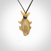 Hand carved stained bone fish pendant. Hand made stained bone fish necklace. Fish themed jewellery. Ocean themed pendant. Bone fish necklace provided with adjustable cord and free delivery.