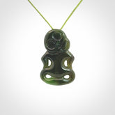 This pendant is a small jade tiki pendant. The carving shows wonderful detail on the front while the back is beautifully rounded. These are carved in Columbian Jade. The cord is adjustable in length. Provided in a woven kete pouch and shipped worldwide.