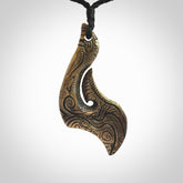 A beautiful hand made, bronze matau pendant.