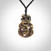 A beautiful hand made, bronze tiki pendant.