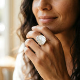 Woman wearing a Mother of pearl ring