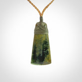 A gorgeous flower jade toki pendant