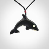 Hand carved black jade and bone Orca pendant. Ocean themed pendants hand carved from natural materials by NZ Pacific. Unique handmade jewellery.