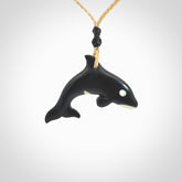 Hand carved black jade and bone Orca pendant. Ocean themed pendants hand carved from natural materials by NZ Pacific. Unique handmade jewellery.