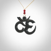 Hand carved black jade Om pendant. Carved from black jade by NZ Pacific. Unique, handmade jewellery for sale online.
