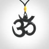Hand carved black jade Om pendant. Carved from black jade by NZ Pacific. Unique, handmade jewellery for sale online.