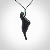 This is a hand carved seal pendant made from a gorgeous and striking piece of black jade stone. Delivered with adjustable cord.