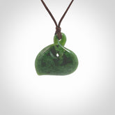 Hand carved New Zealand jade, single twist pendant. Maori pikorua pendant hand carved in New Zealand. Made by NZ Pacific, jade jewellery for sale online. One only hand made by Ross Crump.