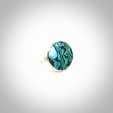 Hand made Paua Shell ring with sterling silver. Paua Shell ring with sterling silver hand made here in New Zealand. Shipping is included in the price.