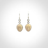 Hand carved Woolly Mammoth Tusk face earrings