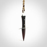A striking hand carved knife pendant. These are carved with a Red Jasper Stone head and a hardwood handle. The cords are hand plaited in our waxed polyester which is robust, strong and durable. We ship these worldwide with express courier.