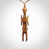 POKERFACE - a traditional Gambier Island figurine, carved as a pendant. This piece was hand carved for us by Yuri Terenyi. This is a work of art and is a collectable piece of traditional bone carving. It can be worn as a special piece of jewellery or displayed. This is art made to wear at its finest.