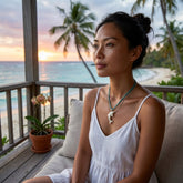 Woman wearing bone dolphin pendant