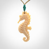 Hand carved woolly mammoth tusk seahorse pendant. Made by NZ Pacific.