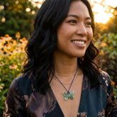Woman wearing jade butterfly pendant