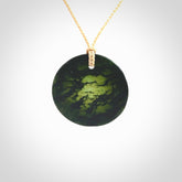 Hand carved New Zealand Jade disc pendant with adjustable beige cord. Unique hand made art to wear.