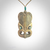 Hand carved incredible Deer Antler wheku face carving. A stunning work of art. This pendant was hand carved in Deer Antler with Paua Shell inlay for the eyes. Shipping is included in the price. Delivered to you on an adjustable cord.