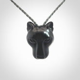 This pendant is a hand carved puma. We've carved this from a lovely piece of black jade and we provide it with a hand plaited cord. Shipping is free worldwide.
