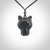 This pendant is a hand carved puma. We've carved this from a lovely piece of black jade and we provide it with a hand plaited cord. Shipping is free worldwide.