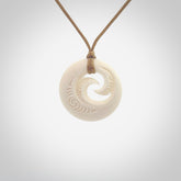 A hand carved and engraved koru pendant carved for us by Yuri Terenyi. These are beautiful little pieces are emblematic of the well known and loved Koru design. Provided with an adjustable cord and packaged in a woven kete pouch. Free worldwide delivery.