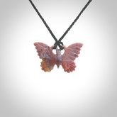 Small Butterfly design pendant carved in Red Agate. Real Agate jewellery for sale online with NZ Pacific. Small butterfly pendant hand made in red agate, provided with adjustable cord and packaged in a woven kete pouch.