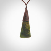 Hand carved pounamu drop pendant. Flower Jade necklace hand made in New Zealand. A drop pendant carved from rare New Zealand Flower jade. NZ Pacific jade jewellery for sale online.