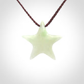 Small Jadeite star pendant. Star shaped necklace hand made from white Jadeite stone. Delivered on an adjustable plum coloured cord and packaged in a woven kete pouch.
