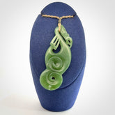 This pendant is a beautiful large New Zealand Inanga jade manaia pendant with koru. It has the head of a bird and the tail of a fish and also two koru carved into the body. It is carved by Ross Crump here in New Zealand. Provided with an adjustable cord.