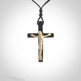 Hand carved black jade crucifix pendant. The cross has been carved from Australian black jade and the Christ from Woolly Mammoth Tusk. This is a beautiful crucifix that has been handmade by NZ Pacific. For sale online and shipping is free.