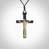 Hand carved black jade crucifix pendant. The cross has been carved from Australian black jade and the Christ from Woolly Mammoth Tusk. This is a beautiful crucifix that has been handmade by NZ Pacific. For sale online and shipping is free.