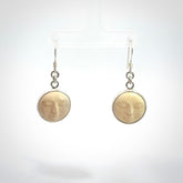 Hand made woolly mammoth tusk moon face earrings. Made by NZ Pacific and sale online only.