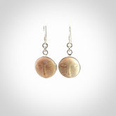 Hand made woolly mammoth tusk moon face earrings. Made by NZ Pacific and sale online only.
