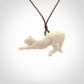 Hand carved bone cat stretching pendant
