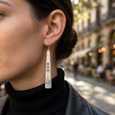 Woman wearing bone earrings