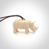 Hand carved Rhinoceros pendant. Carved from woolly mammoth tusk by NZ Pacific.