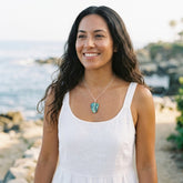 Woman wearing paua shell and sterling silver necklace