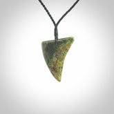This is a lovely New Zealand Jade, pounamu drop pendant. Hand carved for us by Ric Moor. It is bound with an adjustable black coloured cord which is length adjustable. Free worldwide shipping.