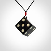 Hand carved black jade and bone dice pendant