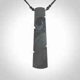 Hand made large New Zealand argillite toki pendant. Hand carved in New Zealand by Rueben Tipene. Hand made jewellery. Unique large argillite Toki with adjustable cord. Free shipping worldwide.