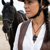 Woman wearing black jade horse pendant