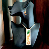 A beautiful, large woolly mammoth tusk with Jade insert toki pendant and woolly mammoth tusk earring.