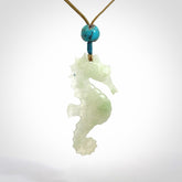 A hand carved Jadeite seahorse pendant. We have carved this from beautiful jadeite and we bind them with our adjustable cords.