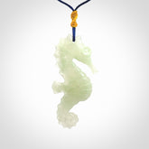 A hand carved Jadeite seahorse pendant. We have carved this from beautiful jadeite and we bind them with our Pacific Blue cords.