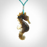 A hand carved labradorite seahorse pendant. We have carved this from beautiful labradorite and we bind them with our hand-plaited cords. The cords are a waxed polyester so they are durable and strong. We ship these worldwide with express courier anywhere in the world.