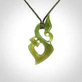 A beautiful hand carved New Zealand Jade Manaia pendant with adjustable olive cord.