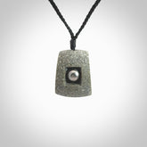 Greywacke stone pendant with Black Pearl insert. Hand carved by Rhys Hall for NZ Pacific. Handmade contemporary jewellery for sale online.
