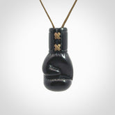 Hand carved boxing glove pendant made from black jade. The cord is adjustable so that you can wear this where it suits you best. We ship these worldwide and the postage is included in the price.