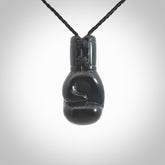 Hand carved boxing glove made from black jade. The cord is adjustable so that you can wear this where it suits you best. We ship these worldwide and the postage is included in the price.
