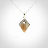 Hand carved mammoth tusk necklace. Made by NZ Pacific and for sale online only. Original and authentic handcrafted jewellery.