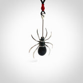 Hand crafted black jade and sterling silver spider necklace. This necklace is provided with a black adjustable cord. Contemporary black jade spider necklace with sterling silver. Delivered with express courier and packaged in a woven kete pouch.